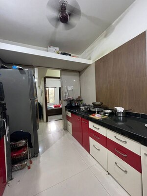 Kitchen in 2 BHK Apartment at Crystal Garden Estate CHS, Manpada – for Rent