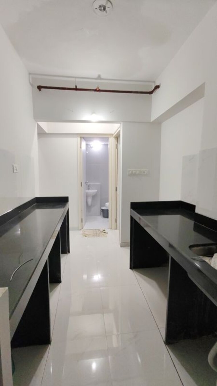 Kitchen, runwal-gardens-phase-i 1.5 Bedroom 665 Sq.Ft. Apartment In Dombivli East Thane 10601671