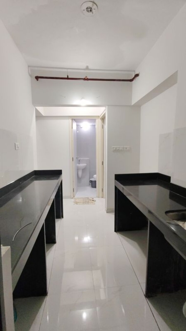 Kitchen, runwal-gardens-phase-i 1.5 Bedroom 665 Sq.Ft. Apartment In Dombivli East Thane 10601671