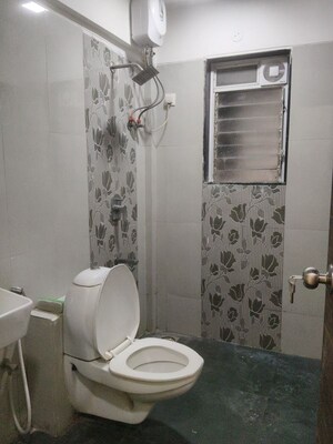 Bathroom in 2 BHK Apartment at Mega Shiv Om Enclave, Santacruz East – for Rent