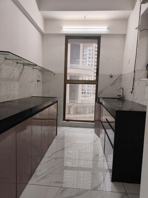Kitchen in 2 BHK Apartment at Raymond Ten X Habitat, Pokhran Road No Two – for Rent