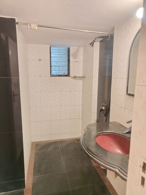 Bathroom in 1 BHK Apartment at Indralok Apartments Andheri, Andheri West – for Rent