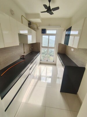 Kitchen in 2 BHK Apartment at Godrej Emerald, Ghodbunder Road – for Rent