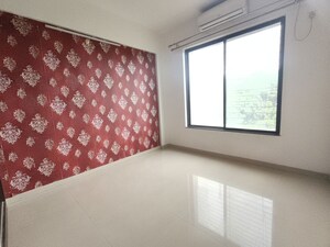Bedroom in 2 BHK Apartment at Kolte Patil Margosa Heights, Mohammadwadi – for Rent