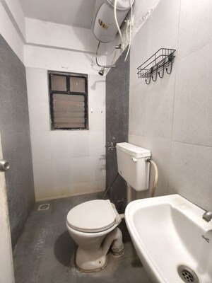 Bathroom in 2 BHK Apartment at Kolte Patil Margosa Heights, Mohammadwadi – for Rent