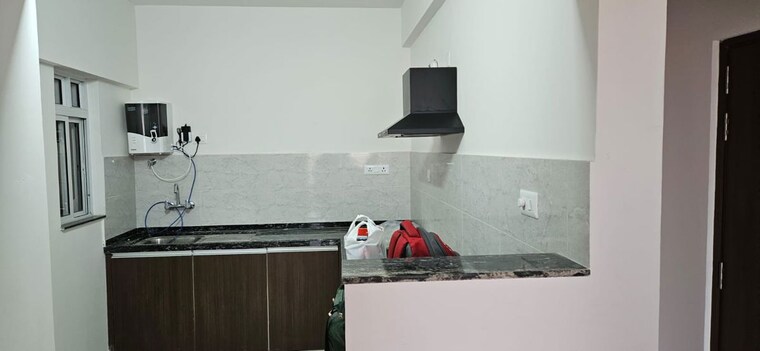Kitchen, gera-world-of-joy 3 Bedroom 1053 Sq.Ft. Apartment In Kharadi Pune 10602741