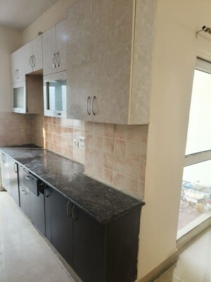 Kitchen in 2 BHK Apartment at Aims Golf City, Sector 75 – for Rent