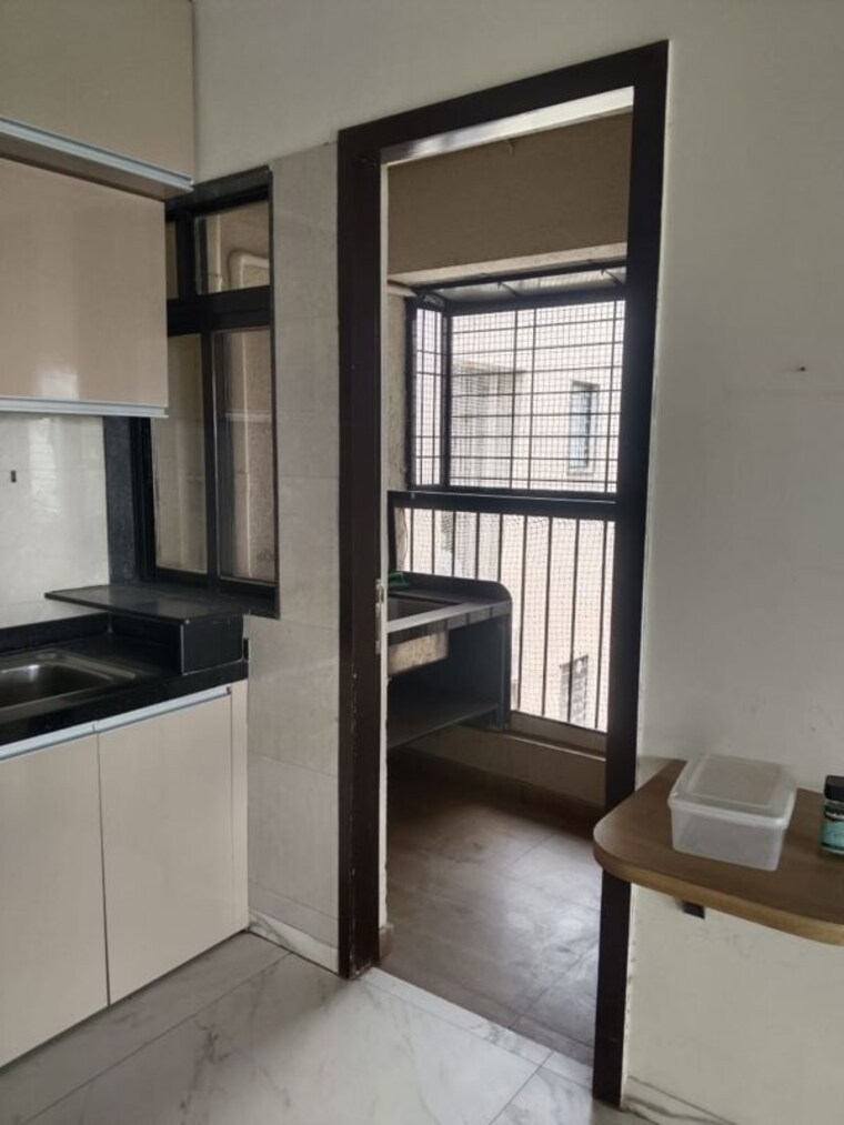 Kitchen, naren-bliss-phase-i 3 Bedroom 1250 Sq.Ft. Apartment In Magarpatta Road Pune 10603331