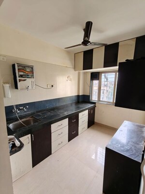 Kitchen in 2 BHK Apartment at Om Gokul Palace, Dhanori – for Rent
