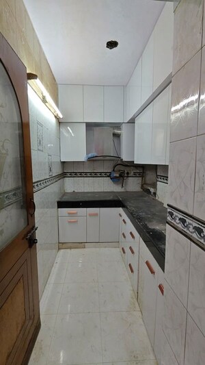 Kitchen in 6+ BHK Independent House at Tarun Enclave – for Sale