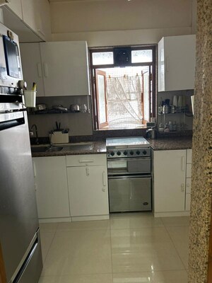 Kitchen in 2 BHK Apartment at Nina Apartments, Modi Colony – for Sale