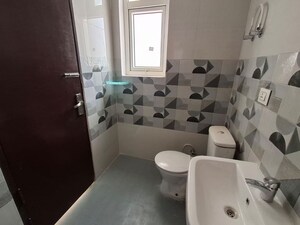 Bathroom in 3 BHK Apartment at HFL Presidency Estate, Alwar Bypass Road – for Rent