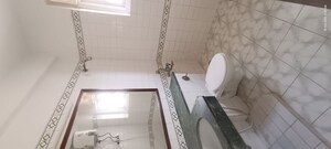 Bathroom in 2 BHK Apartment at Eros Sterling Apartments, Charmwood Village – for Rent