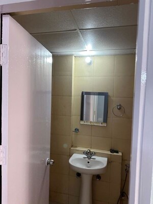 Bathroom in 2.5 BHK Apartment at Mahagun My Woods, Sector 16c Greater Noida – for Rent