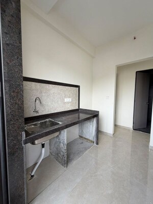 Kitchen in 1 BHK Apartment at Dhamji Shamji Mahavir Spring Tulip Phase 1, Pokhran Road No Two – for Rent
