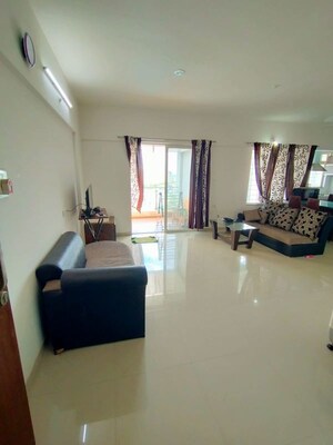 Living Room in 1 BHK Apartment at Magarpatta City Iris, Hadapsar – for Rent
