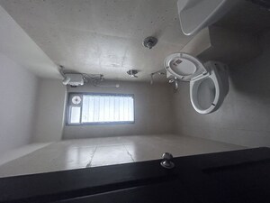 Bathroom in 2 BHK Apartment at JD Happy Home Enclave, Goregaon West – for Rent