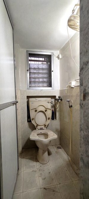 Bathroom in 2 BHK Apartment at The Kamal Sagar CHS, Bhandup East – for Rent