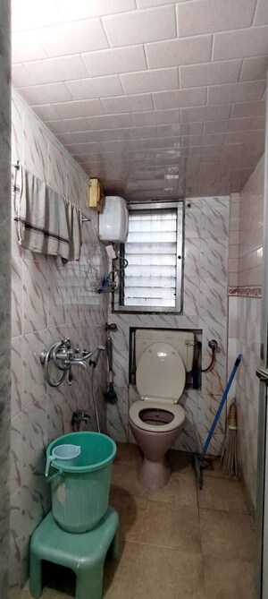 Bathroom in 2 BHK Apartment at The Kamal Sagar CHS, Bhandup East – for Rent
