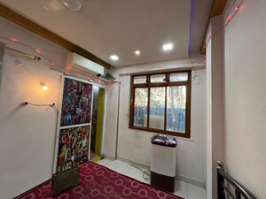 Living Room in Studio Apartment at Sai Niwas CHS, Malad West – for Sale