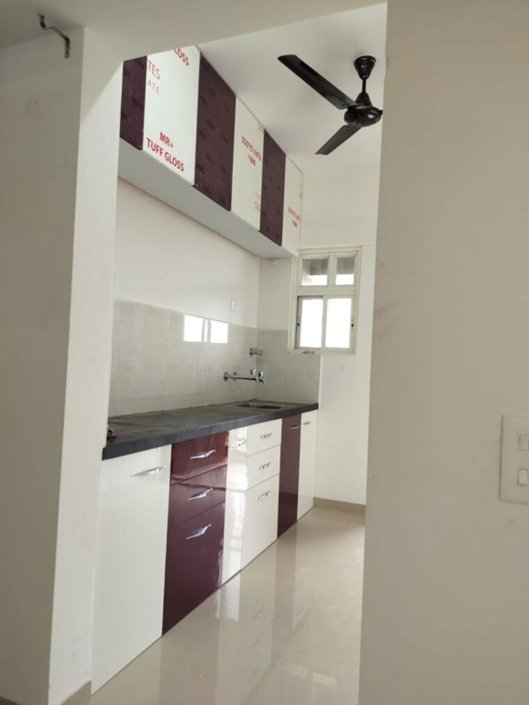 Kitchen, nyati-defence-enclave 1 Bedroom 550 Sq.Ft. Apartment In Undri Pune 10565897
