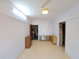 Living Room in 1 BHK Apartment at Vasant Gulmohar CHS, Vasant Vihar – for Sale