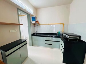 Kitchen in 2 BHK Apartment at Godrej Green Glades, Jagatpur – for Rent