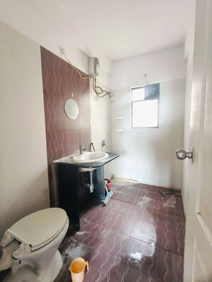 Bathroom in 2 BHK Apartment at Kolte Patil Margosa Heights, Mohammadwadi – for Rent
