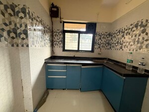Kitchen in 1 BHK Apartment at Unnati Woods CHS, Kasarvadavali – for Rent