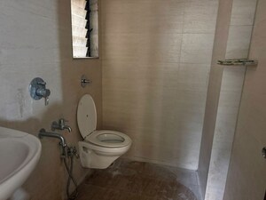Bathroom in 1 BHK Apartment at Unnati Woods CHS, Kasarvadavali – for Rent