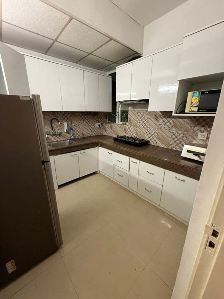 Kitchen, ansal-sushant-estate 2 Bedroom 1000 Sq.Ft. Apartment In Sector 52 Gurgaon 10606427