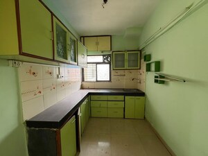 Kitchen in 2 BHK Apartment at Sukur Residency B1 CHS Ltd, Kasarvadavali – for Rent