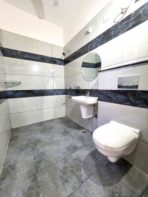 Bathroom in 4 BHK Apartment at Dhakoli – for Sale