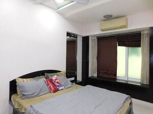 Bedroom in 2 BHK Apartment at Olympia Tower, Jacob Circle – for Rent