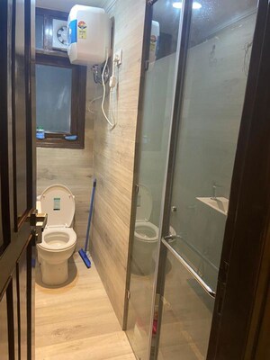 Bathroom in 4 BHK Builder Floor at Chattarpur – for Rent