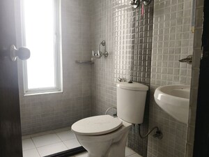 Bathroom in 3 BHK Apartment at Landcraft Golf Links, Pandav Nagar – for Rent
