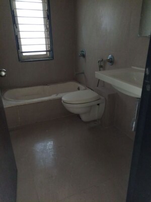 Bathroom in 3 BHK Apartment at Gokhale Anuprita, Dahanukar Colony – for Rent