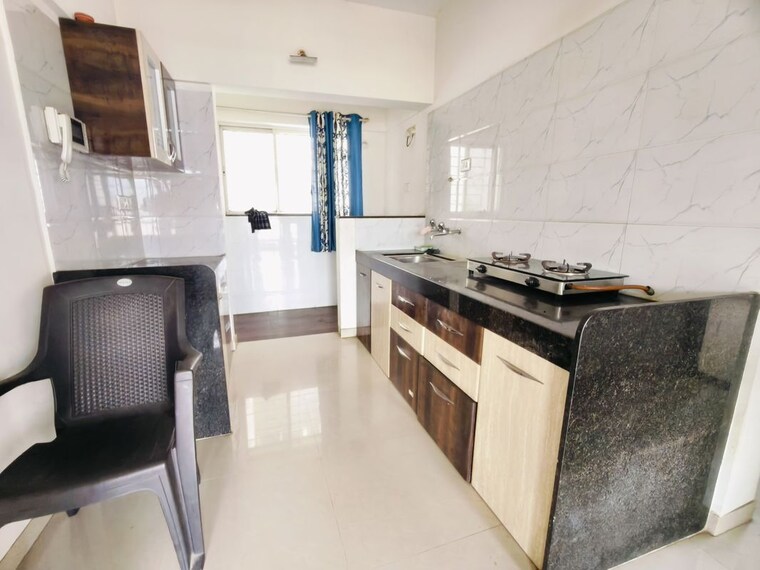 Kitchen, sree-mangal-little-hearts 2 Bedroom 1000 Sq.Ft. Apartment In Undri Pune 10607299