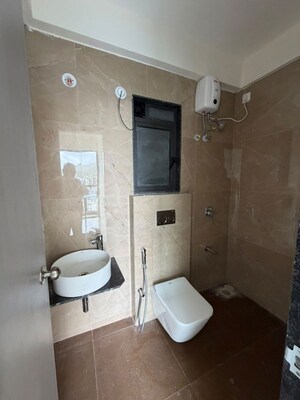 Bathroom in 1 BHK Apartment at Dhamji Shamji Mahavir Spring Tulip Phase 1, Pokhran Road No Two – for Sale