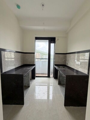 Kitchen in 2 BHK Apartment at Dhamji Shamji Mahavir Spring Tulip Phase 1, Pokhran Road No Two – for Sale