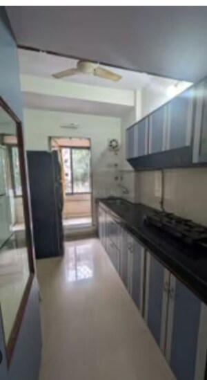 Kitchen in 1 BHK Apartment at Satellite Garden, Goregaon East – for Rent