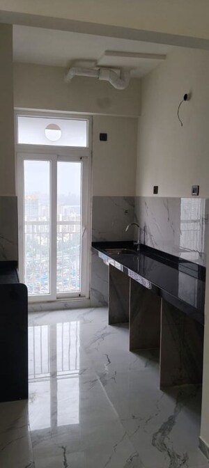 Kitchen in 2 BHK Apartment at Ruparel Sky Green, Kandivali West – for Rent