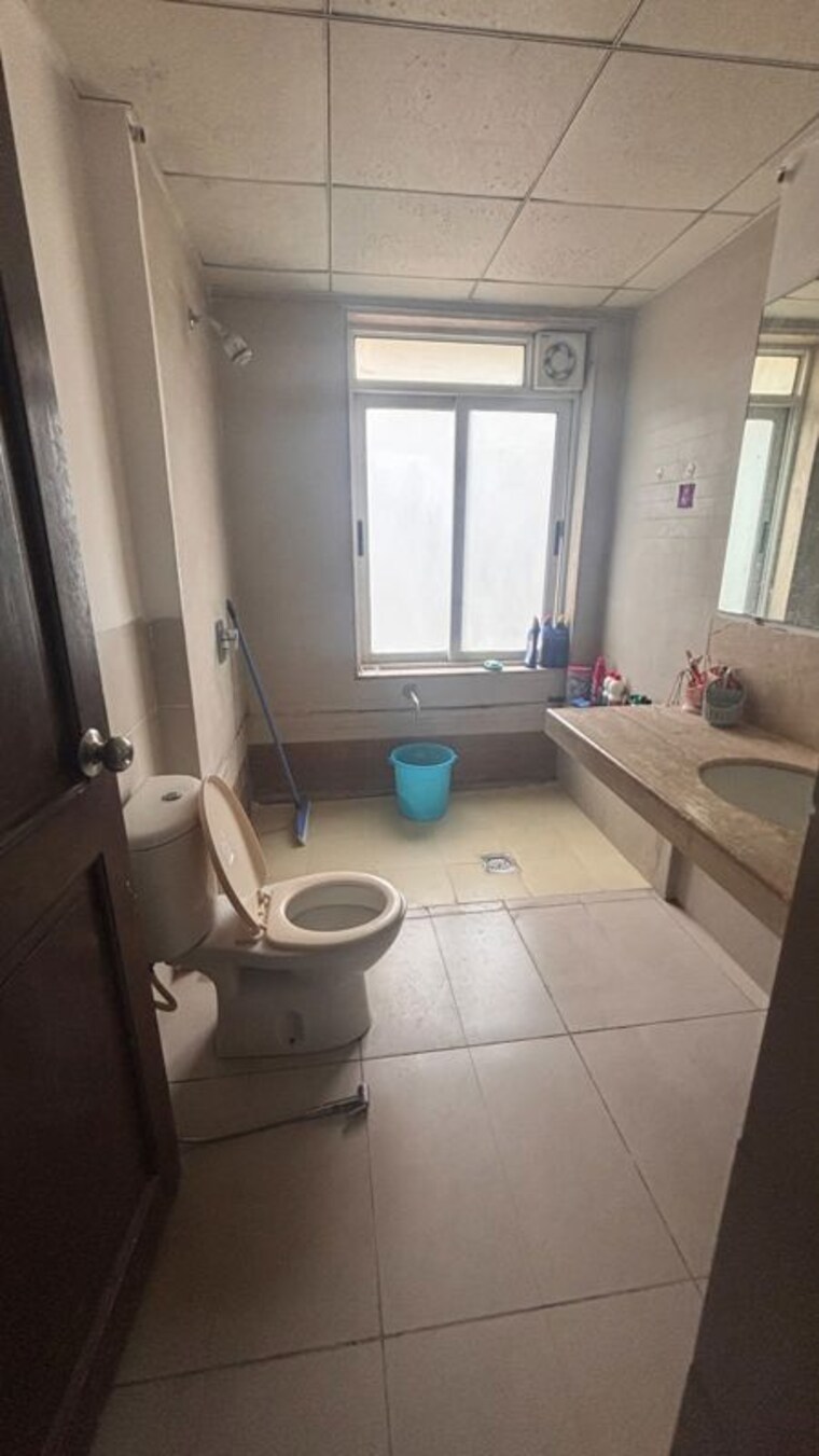 Bathroom, magarpatta-city-cosmos 2 Bedroom 900 Sq.Ft. Apartment In Magarpatta Road Pune 10607570