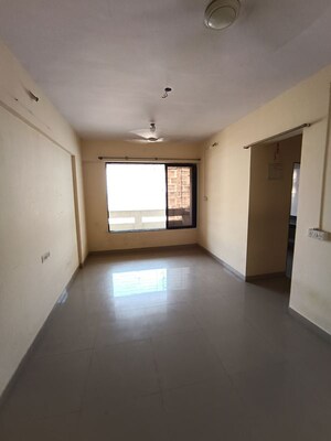 Living Room in 1 BHK Apartment at Ajmera Yogi Dham Phase III, Kalyan West – for Sale