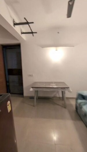 Living Room in 1 BHK Apartment at Urbtech Xaviers, Sector 168 – for Rent