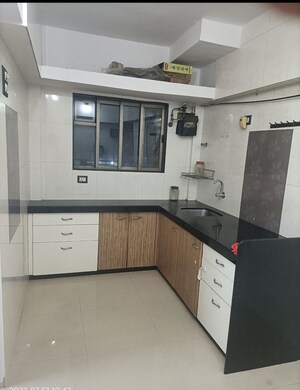 Kitchen in 1 BHK Apartment at Dedhia Platinum Lawns, Ghodbunder Road – for Sale