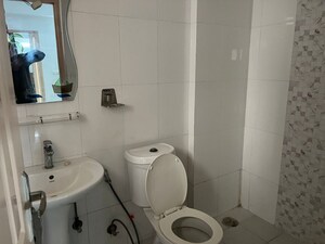 Bathroom in 3 BHK Apartment at Mahagun Moderne, Sector 78 – for Sale