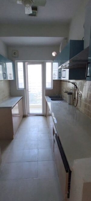 Kitchen in 3 BHK Apartment at Mahagun Moderne, Sector 78 – for Rent