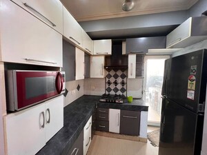 Kitchen in 2.5 BHK Apartment at Paramount Floraville, Sector 137 – for Rent