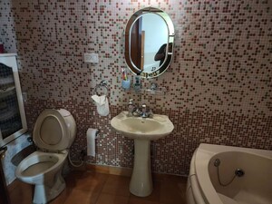 Bathroom in 4 BHK Apartment at Embassy Eros, Halasuru – for Rent